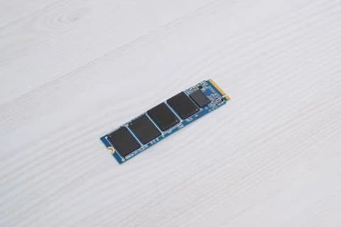 M2 NVMe SSD module placed on light wooden surface, modern solid state stora.. Stock Photos