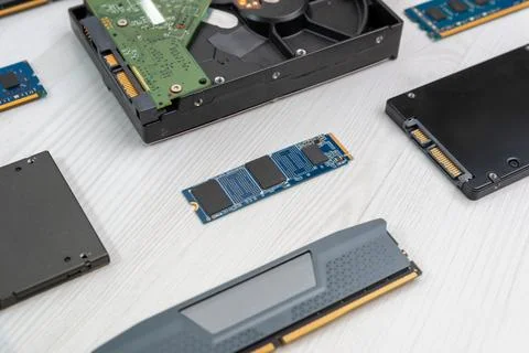 M2 SSD drive surrounded by hard disk drive, SATA SSD and RAM modules arrang.. Stock Photos