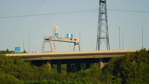 M4 Motorway Overpass Bridge at Junction 42 Fabian Way with Electricity Pylons Stock Footage 318005491