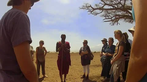Maasai Chief visits with outsiders Stock Footage 10789435