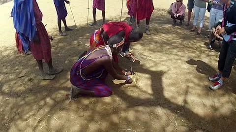 Maasai shows outsiders how to start fire 2 Stock Footage 10789489