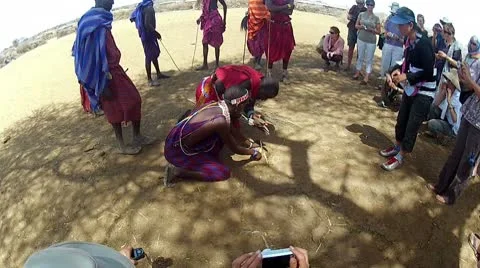 Maasai shows outsiders how to start fire Stock Footage