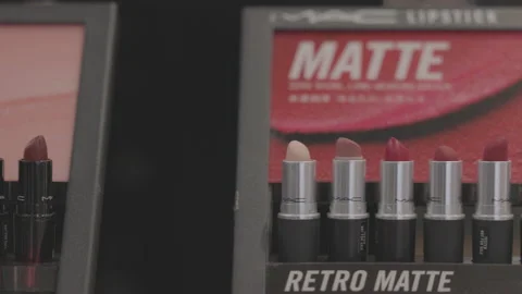 MAC lipstick on the stand. MAC lipstick testers displayed in a luxurious store Stock Footage 171484104