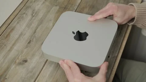 Mac Mini M1 Apple computer held in male hands, technology portability, work.. Stock Footage 301877941