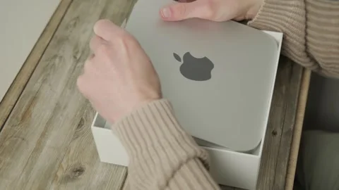 Mac Mini M1 Apple computer held in male hands, technology portability, work.. Stock Footage 305678069