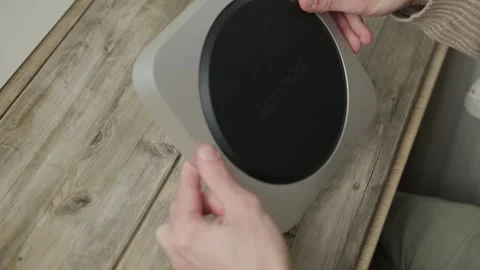 Mac Mini M1 Apple computer held in male hands, technology portability, work.. Stock Footage 311134332
