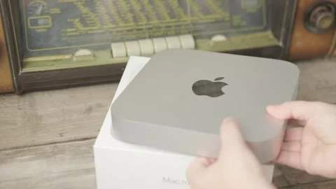 Mac Mini M1 Apple computer held in female hands, technology portability, wo.. Stock Footage 313295933