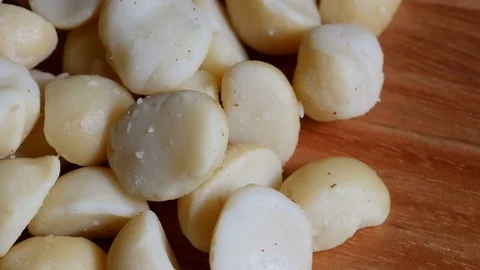 Macadamia nut kernels, close up, overhead view Stock Footage 76460470