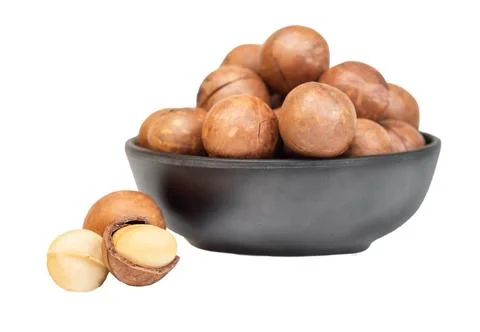Macadamia nuts in bowl isolated Stock Photos