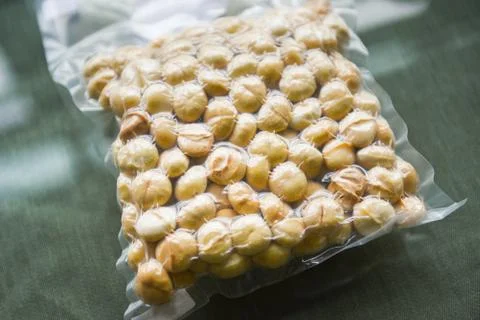Macadamia nuts in vacuum packaging - macadamia nut shelled from natural high  Stock Photos