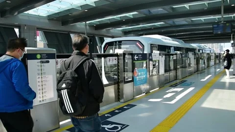 Macao Light Rapid Transit arriving at Taipa Ferry Terminal Station Stock Footage 235923374