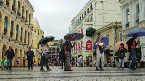Macao - People with umbrellas at Largo do Senado square. 4K resolution. Stock Footage 70529199