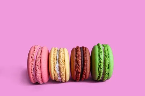 Macaron Cakes Or Macaroon On Colored pink fuksia Background Stock Photos