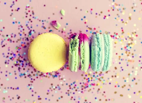Macaron with confetti and pink background Stock Photos
