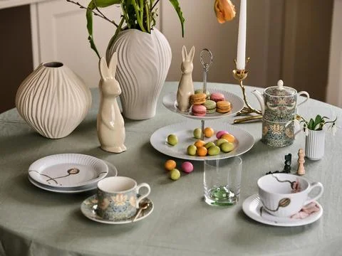 Macaron Cookies and Easter Rabbit on Festive Tea Table Stock Photos