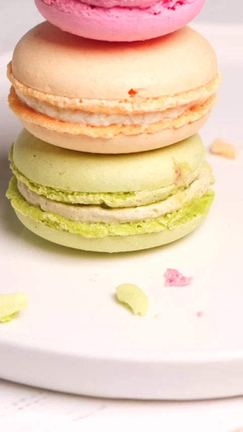 Macaron different colours cookies on white plate background Stock Footage 278887045