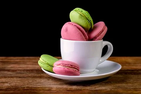 Macaron inside a coffee cup Stock Photos