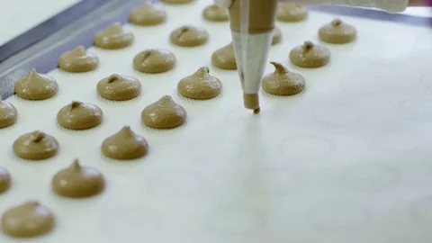Macaron making process, women hands squeezing the dough Stock Footage 72287862