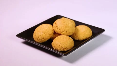 Macaron on a plate rotating Stock Footage 303251310