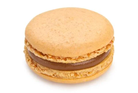 Macaron with salted caramel cookie isolated on a white background. Stock Photos