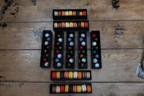 Macarones pack on wooden table background Stock Photos