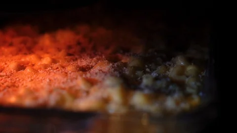 Macaroni and cheese baking inside an oven Stock-Footage 93189722