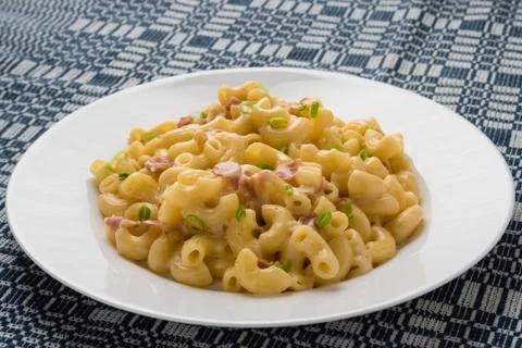 Macaroni and cheese on table Stock Photos
