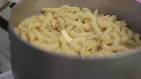 Macaroni and spaghetti are cooked in the pan Stock Footage 71114124
