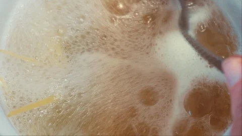 Macaroni and spaghetti are cooked in a pan in the water. Stock Footage 126812194