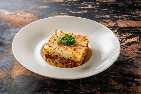 Macaroni bechamel served in a dish isolated on dark background side view food Stock Photos