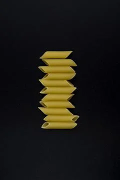 Macaroni on black background in flat lay 스톡 사진