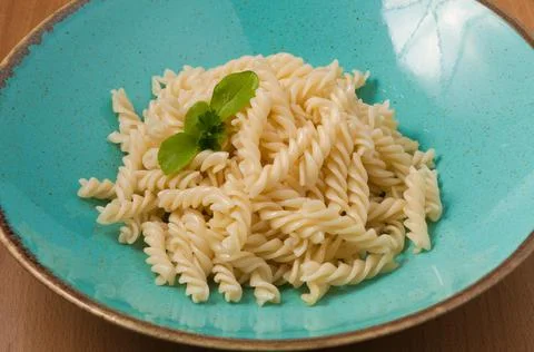 Macaroni boiled in a plate. close up Stock Photos