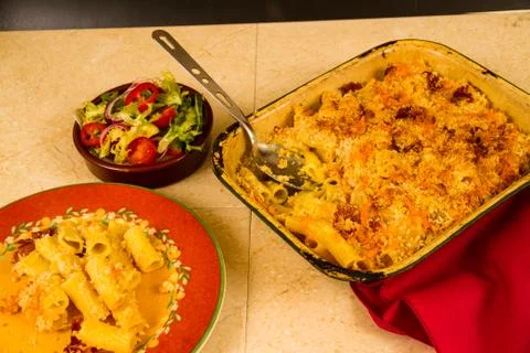 Macaroni Cheese or Mac and Cheese with salad. Stock Photos