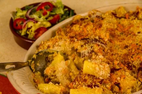 Macaroni Cheese or Mac and Cheese with salad. Stock Photos