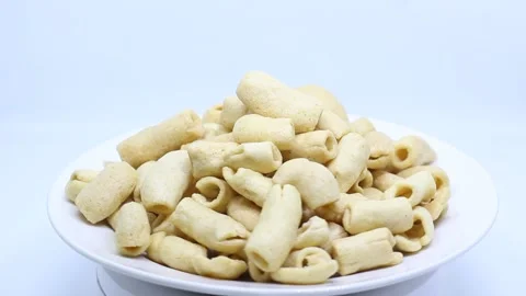 Macaroni crackers on white background Stock Footage 222802036