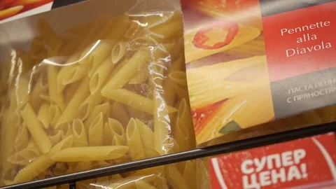 Macaroni in the package on the counter in the grocery store Stock Footage 75222495