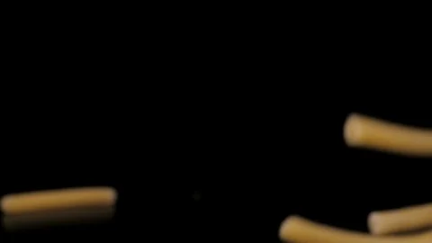 Macaroni Pasta Falling Down black background, slow motion Stock Footage 112456326