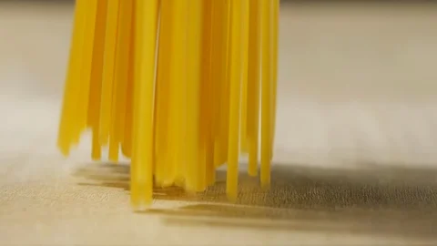 Macaroni pasta falling in slow motion on wooden Stock-Footage 113594308