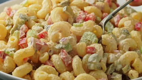 Macaroni Salad with red bell pepper, onion, celery, gherkins and mayonnaise Stock Footage 154208374