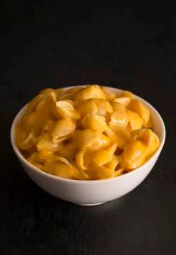 Macaroni Shells and Cheese on a Dark Slate Background Stock Photos