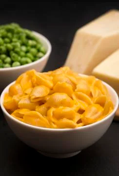 Macaroni Shells and Cheese on a Dark Slate Background Stock Photos