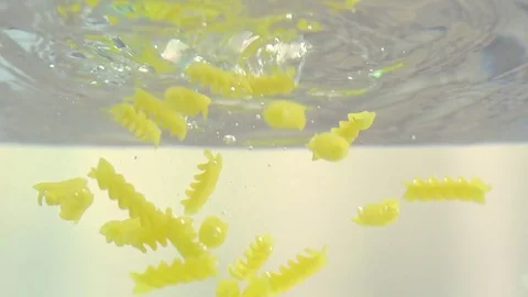 Macaroni in water in slow motion Stock Footage 76040903