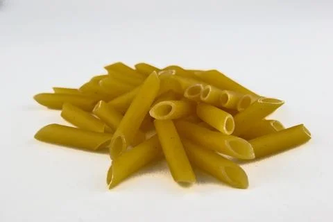 MACARONI IN WHITE BACKGROUND Stock Photos