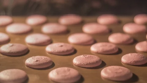 Macarons baking in oven mitt. slowmo 4K footage Stock Footage 97413413