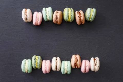 Macarons cake, top view flat lay, pattern macaroon, black background 스톡 사진