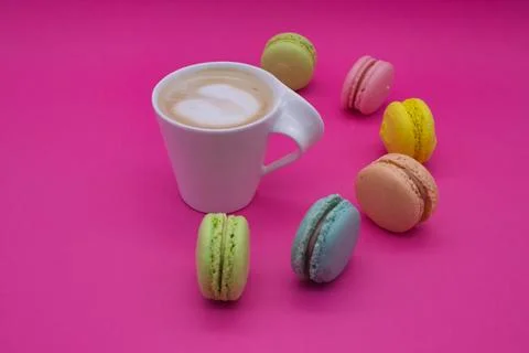 Macarons with Coffee on a Pink Background Stock Photos