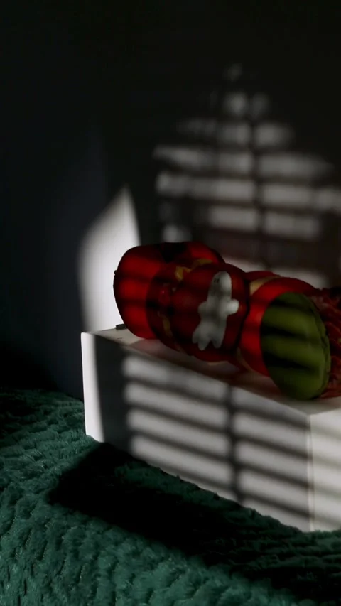 Macarons with Halloween ghost design sitting on a white box with blinds sha.. Stock Footage 342793184