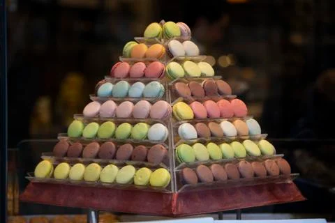 Macarons lined up on the pyramid bench. Close-up. Stock Photos