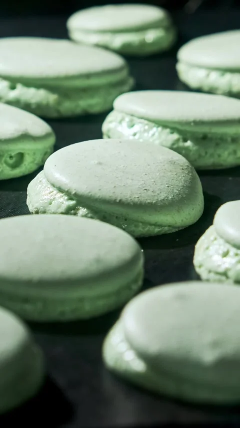 Macarons in oven. Cooking macarons. Mistake in process. Vertical video Stock Footage 301402882