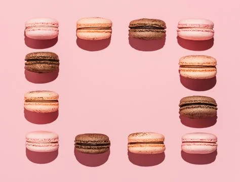 Macarons on pink, copy space, hard light Fotos Stock